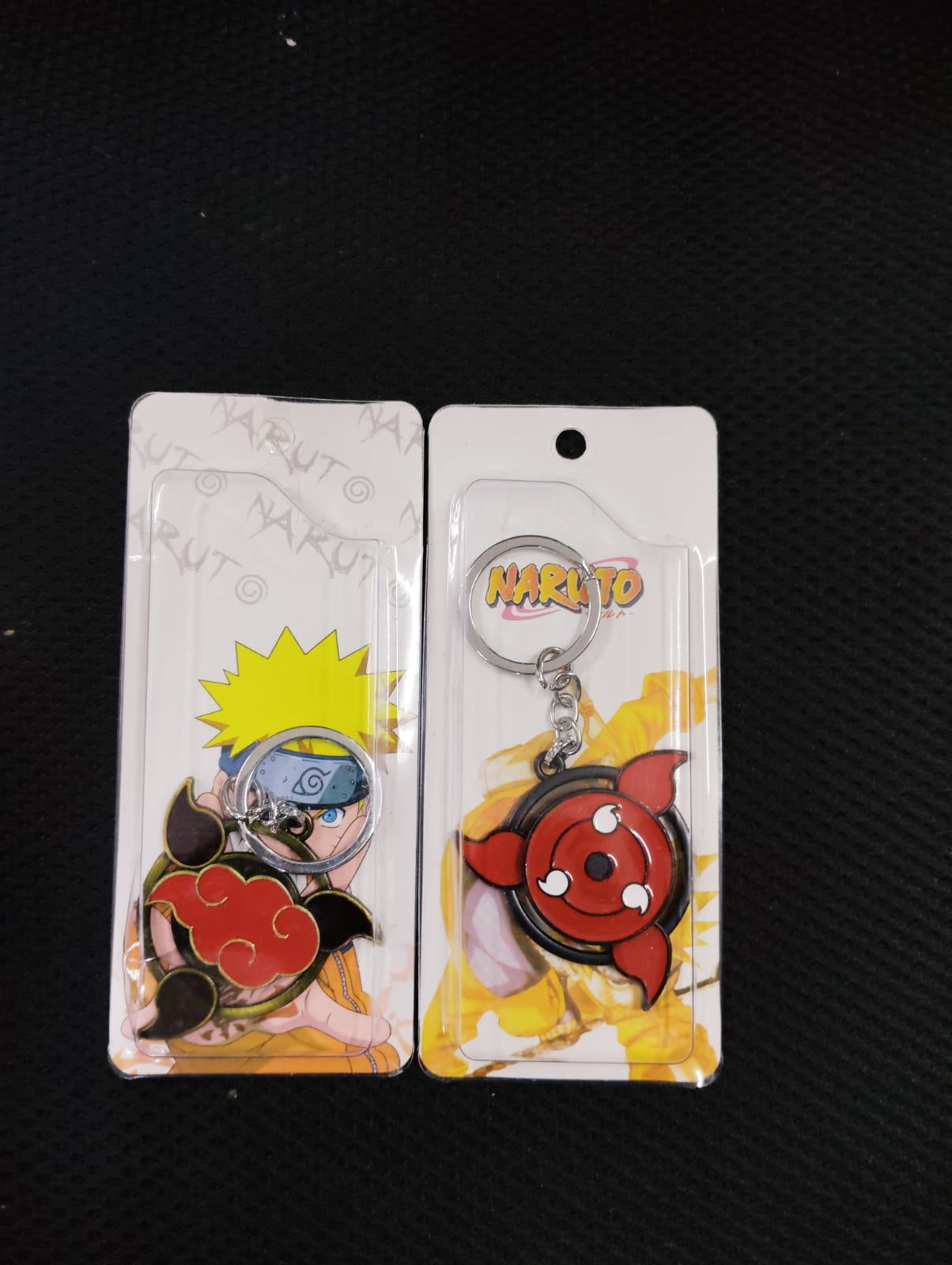 pack of 6 Red logo natuto rotating keychain (eff price 48)