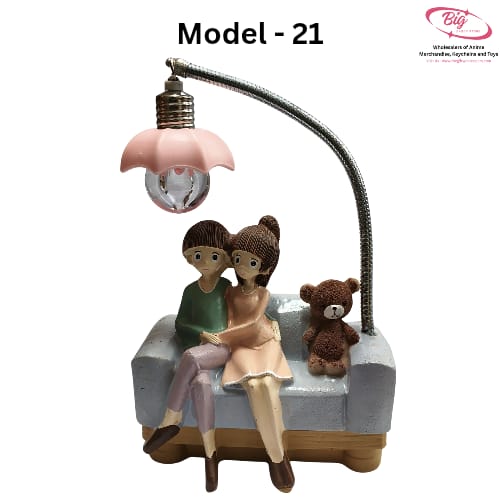 Couple sitting on blue sofa with teddy lamp Model 21