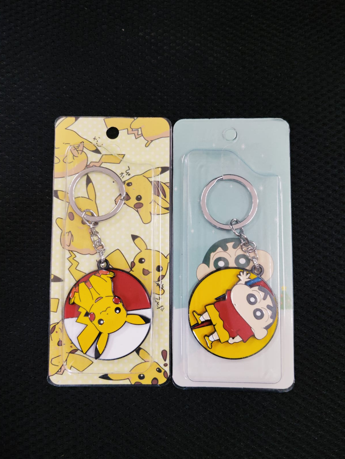 Shinchan / pikachu rotating keychains pack  of 6 ( eff price - 48 )